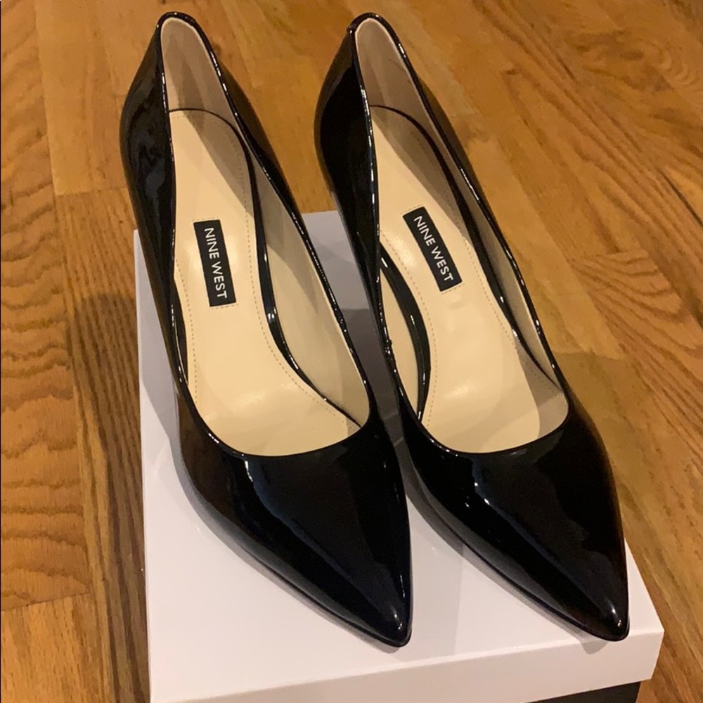 Never worn! Black Patent leather Nine West Pumps.
